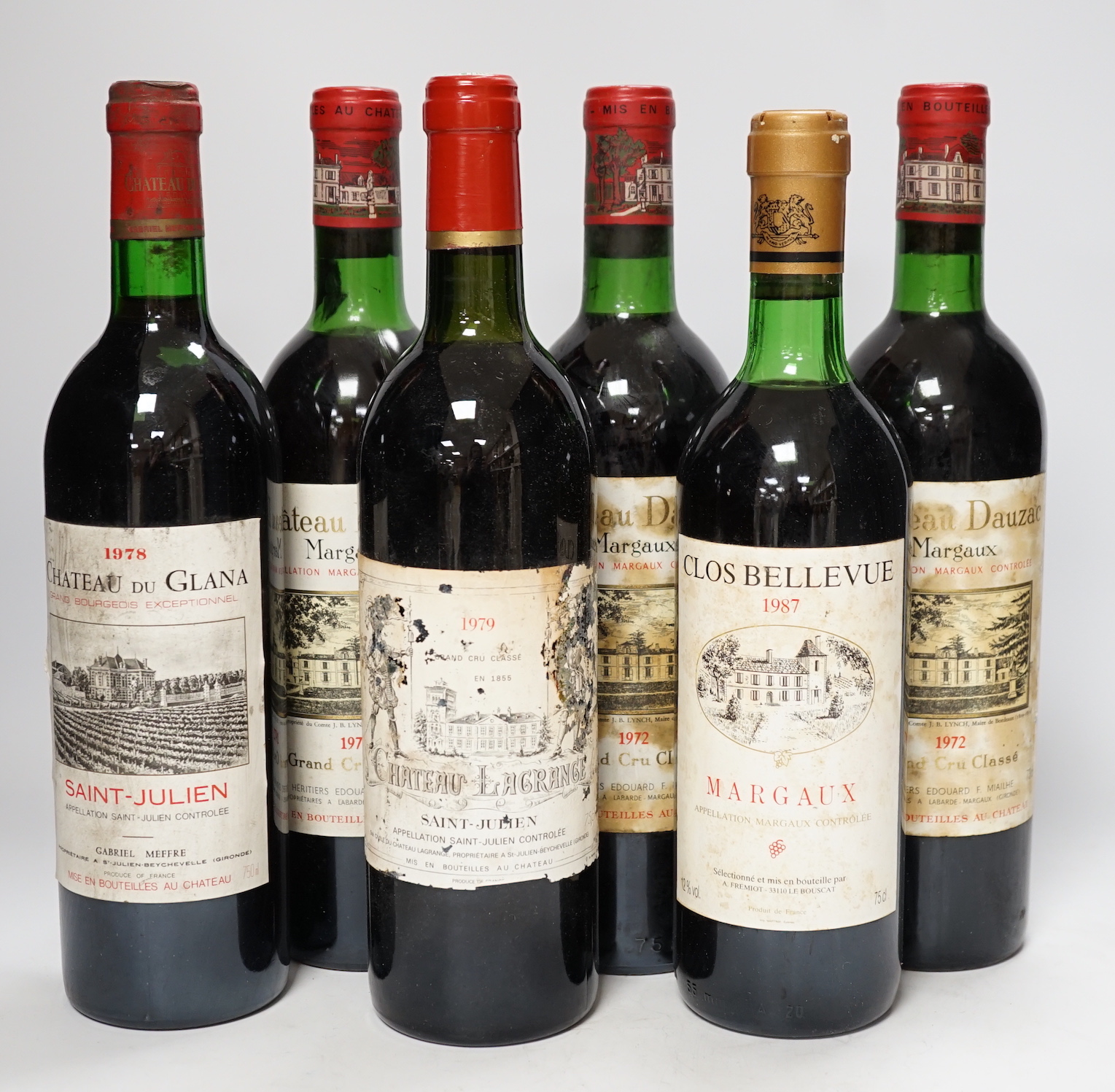 Three bottles of Chateau Dauzac Margaux 1972 and three other bottles Chateau Du Glana Saint Julien 1978, Chateau Lagrange Saint Julien 1979 and Clos Bellevue Margaux 1987